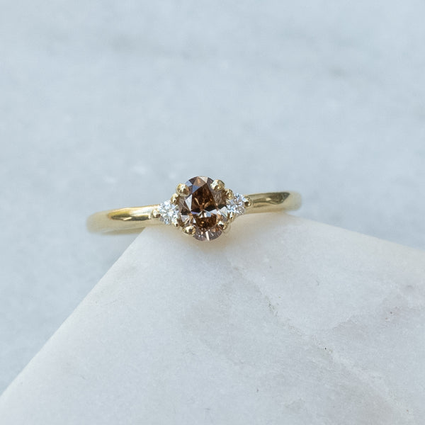 3 stone ring brown diamond with white side diamonds in low setting