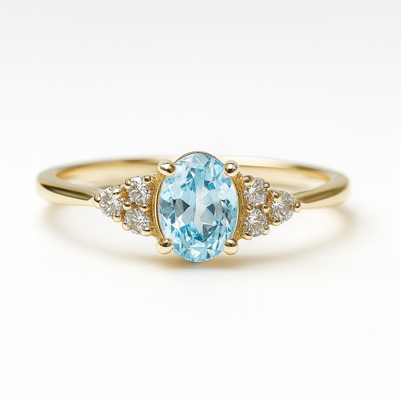 gold engagement ring with a blue gemstone on a white background. Sapphire. and diamond in 14 carat gold engagement ring