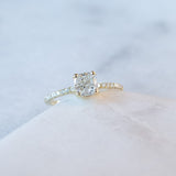 cushion cut diamond ring with pave set diamonds on ring