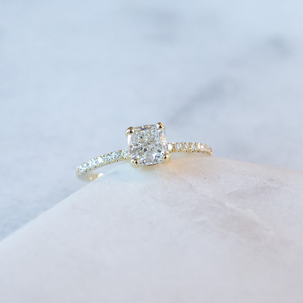 cushion cut diamond ring with pave set diamonds on ring