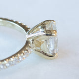 cushion cut diamond ring with pave set diamonds on ring