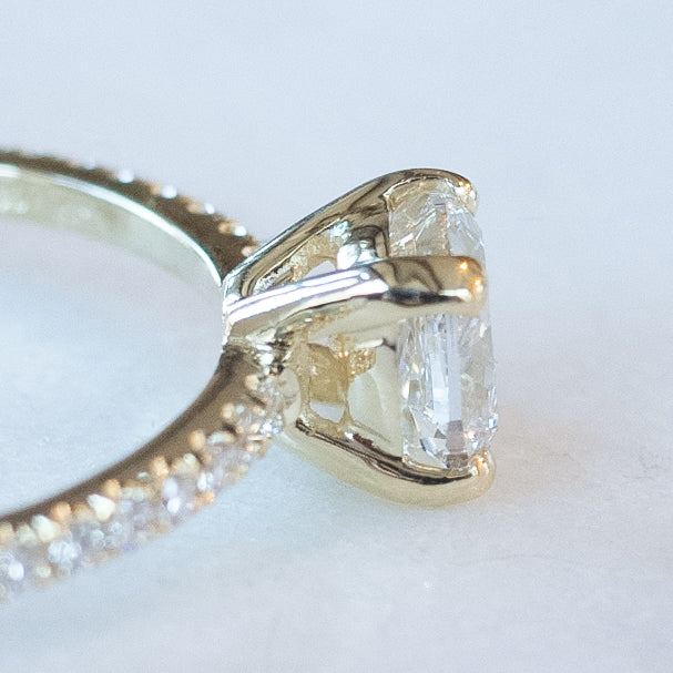 cushion cut diamond ring with pave set diamonds on ring