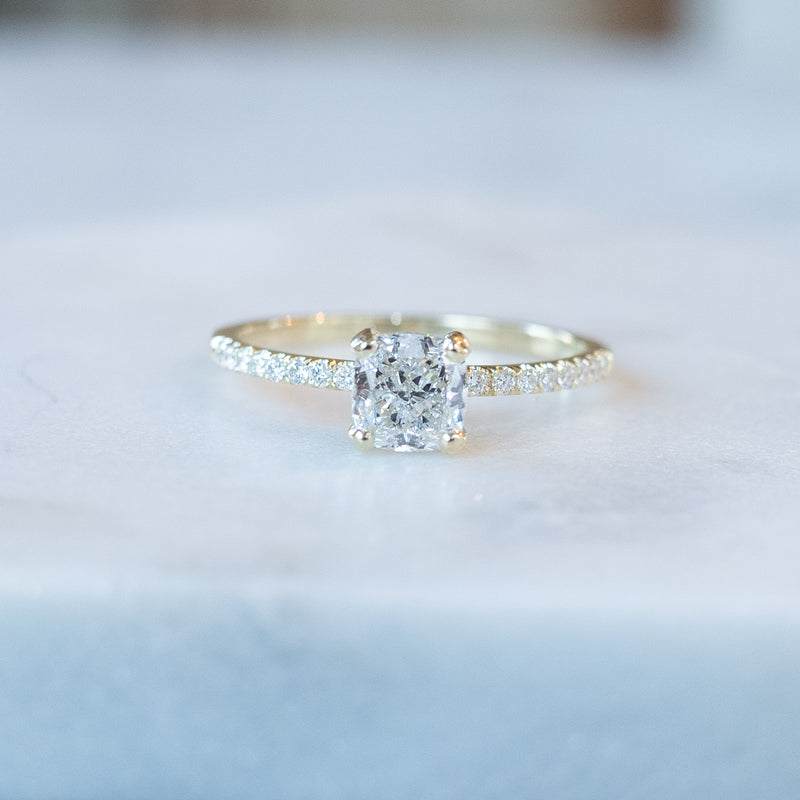 cushion cut diamond ring with pave set diamonds on ring