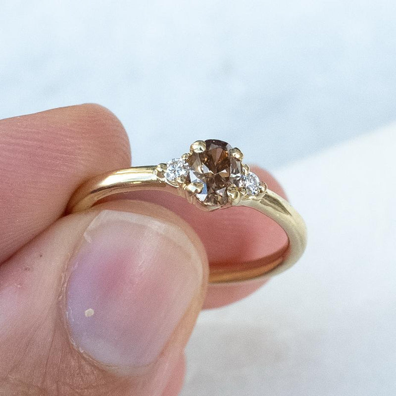 3 stone ring brown diamond with white side diamonds in low setting