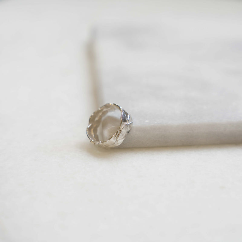 Melanie Pigeaud caesar ring in sterling silver presented on marble