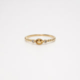 Melanie Pigeaud ring with citrine stone and two zirconia's in 9k gold