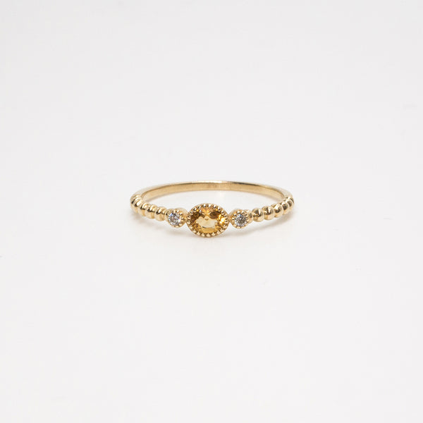 Melanie Pigeaud ring with citrine stone and two zirconia's in 9k gold
