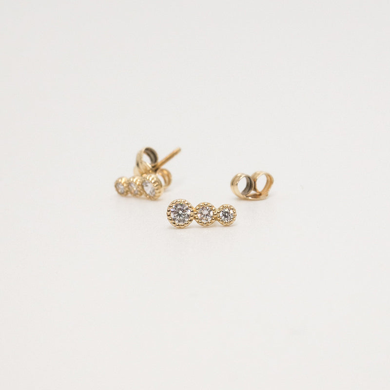 Melanie Pigeaud zirconia round dots earrings in 9k gold